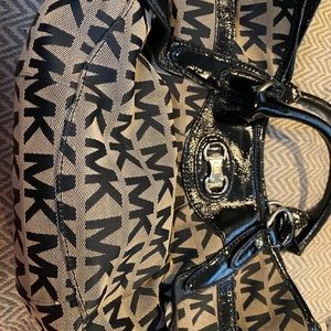 Michael Kordsmeier tan and black  bag .